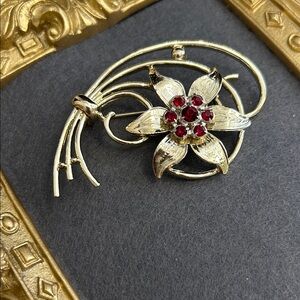 Gold-Tone Floral Brooch with Red Crystal Accents